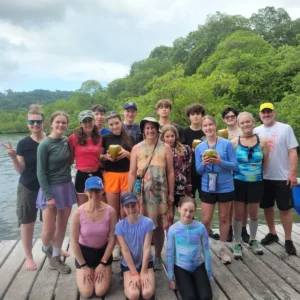 Group of homeschool worldschoolers on a dock in Bocas del Toro, Panama