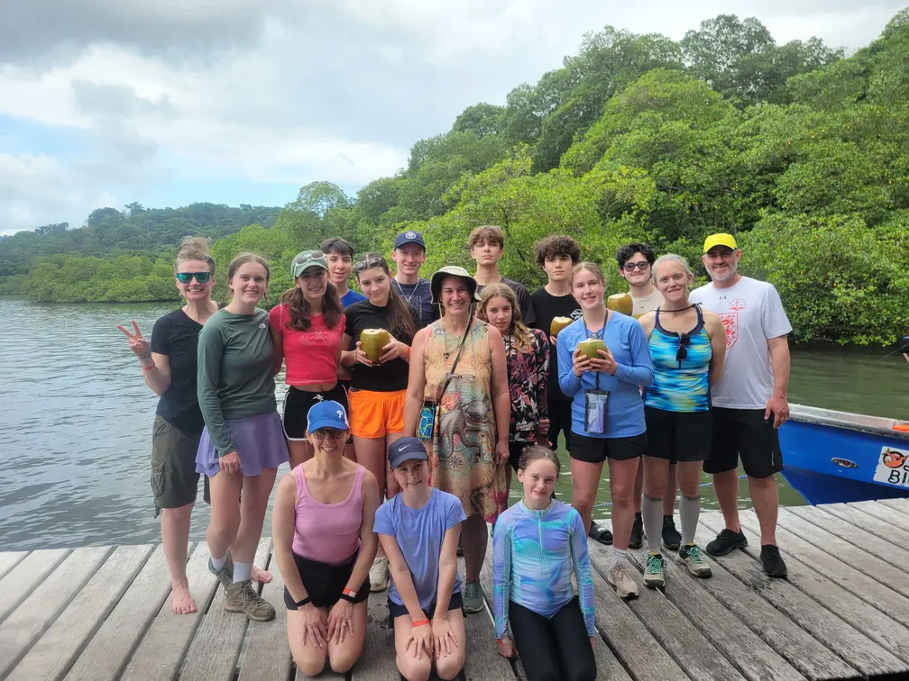 Group of homeschool worldschoolers on a dock in Bocas del Toro, Panama